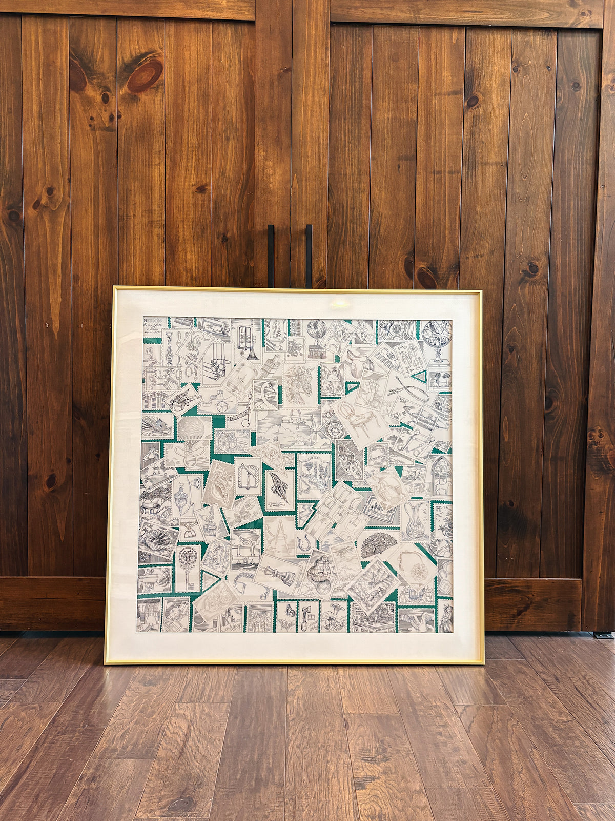 Elegant silk scarf frame in gold with intricate detailing, designed to display silk scarves beautifully, by Soleil Royale.
