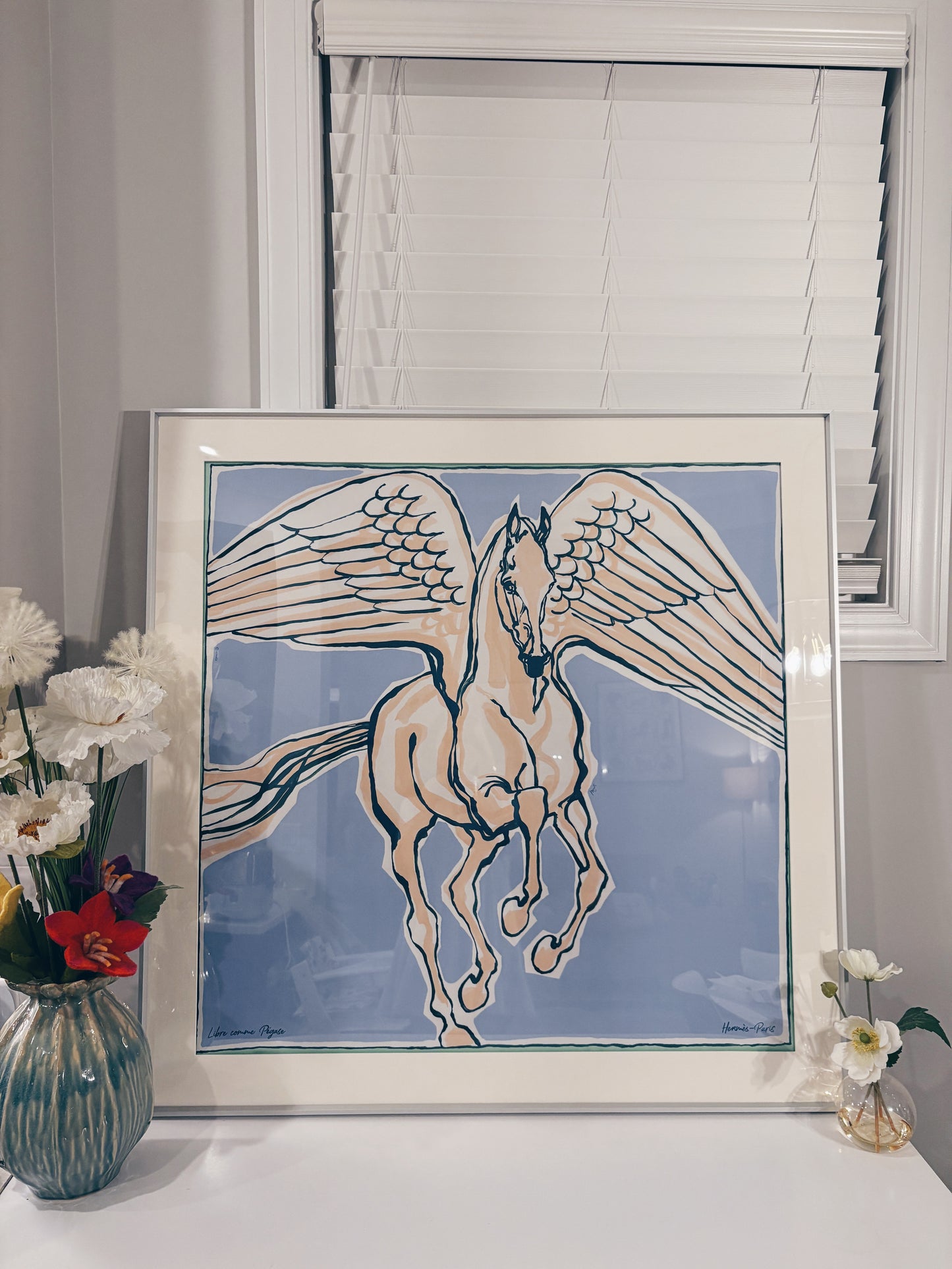 Hermes silk scarf displayed in a luxury silver scarf frame with couture patterned matting, perfect for wall display.